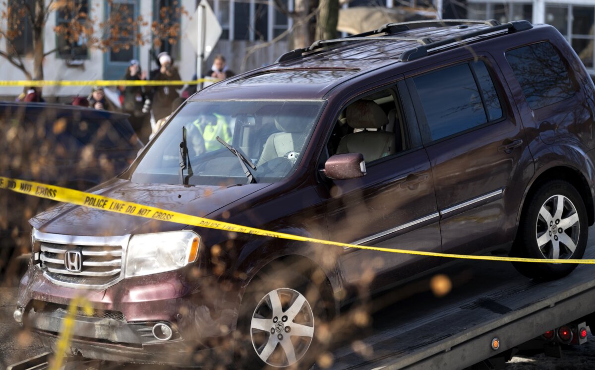 A vehicle is towed away after a shooting by an ICE agent during federal law enforcement operations in Minneapolis on Jan. 7, 2026. (Stephen Maturen/Getty Images)