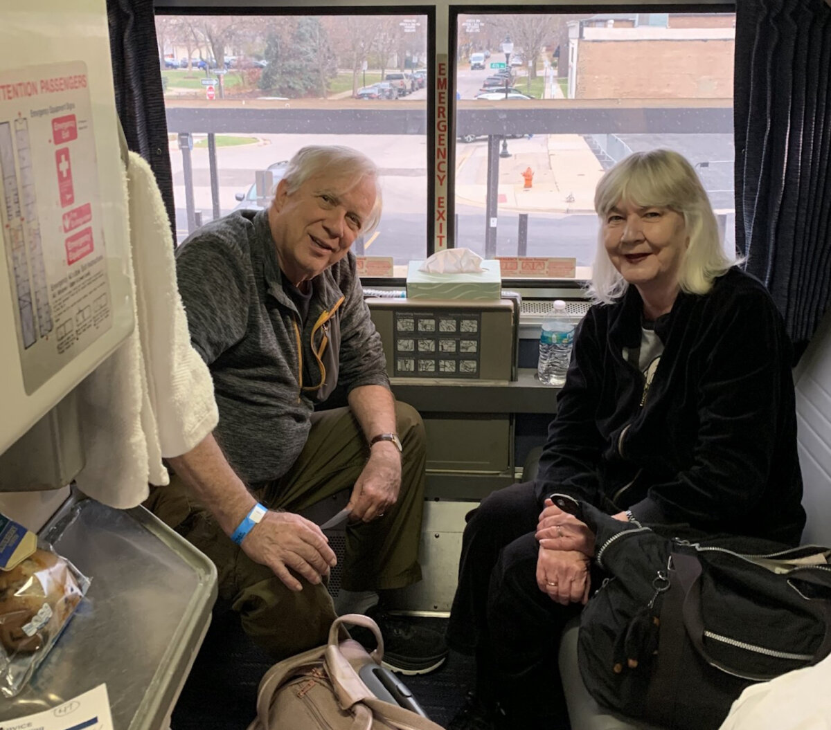 Author Sharon Whitley Larsen (R) and her husband, Carl, enjoy the view from their cramped bedroom sleeper car during an Amtrak trip. (Sharon Whitley Larsen)