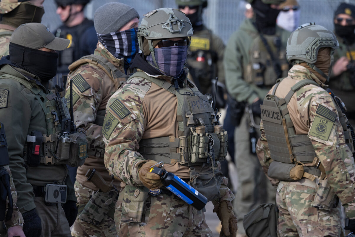 Immigration and Customs Enforcement agents in front of the Bishop Henry Whipple Federal Building in Minneapolis on Jan. 12, 2026. (John Fredricks/The Epoch Times)
