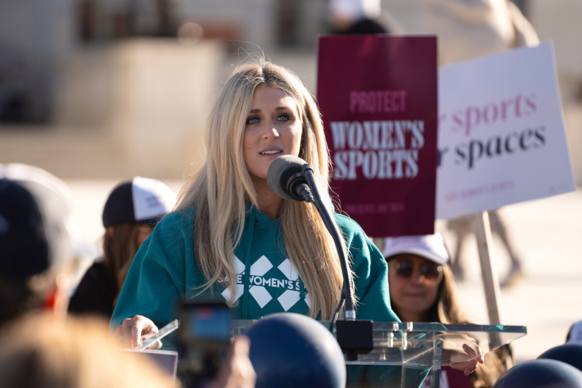 Riley Gaines speaks at a rally outside the U.S. Supreme Court as justices hear arguments in two cases in which states have banned males from participating in female-only sports, in Washington on Jan. 13, 2025. (Madalina Kilroy/The Epoch Times)