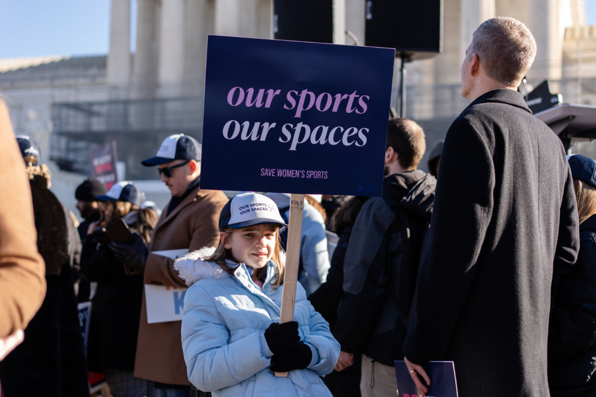 People take part in a rally outside the U.S. Supreme Court as justices hear arguments in two cases in which states have banned males from participating in female sports, on Jan. 13, 2025. (Madalina Kilroy/The Epoch Times)