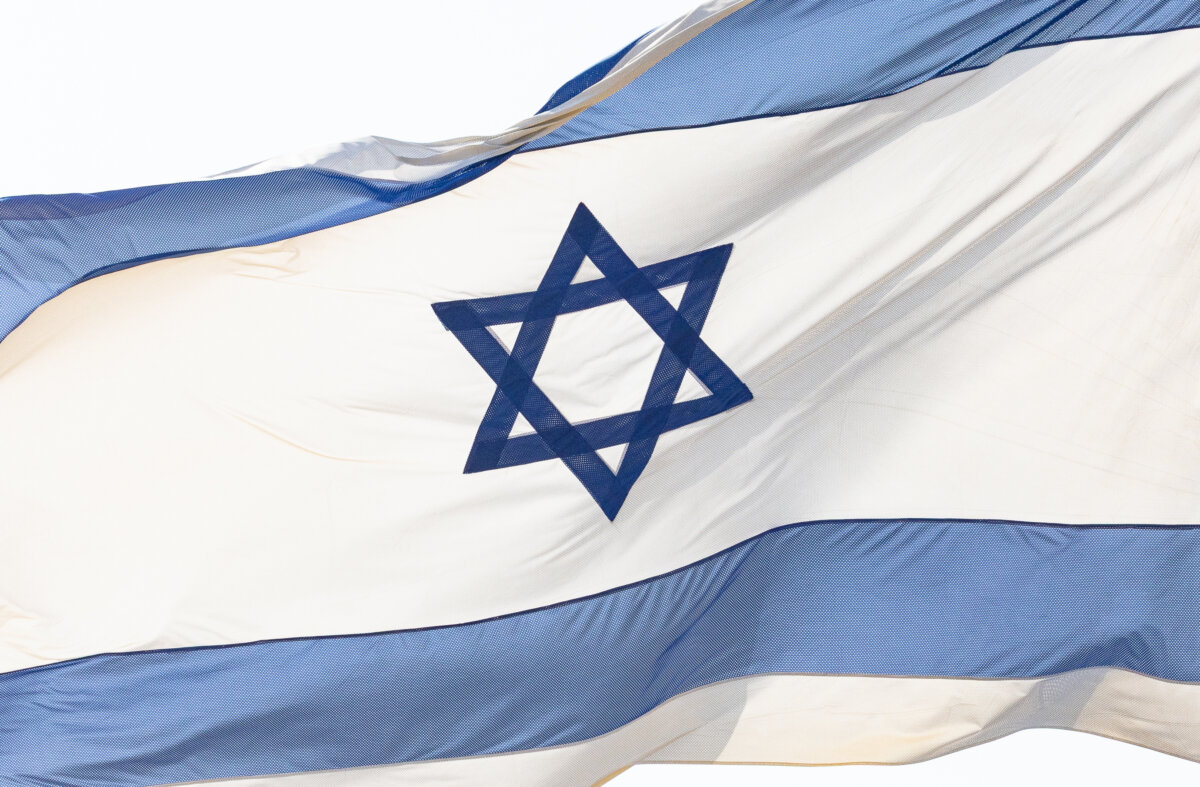 The Israeli flag blows near Ashkeon, Israel, on Nov. 18, 2025. (John Fredricks/The Epoch Times)