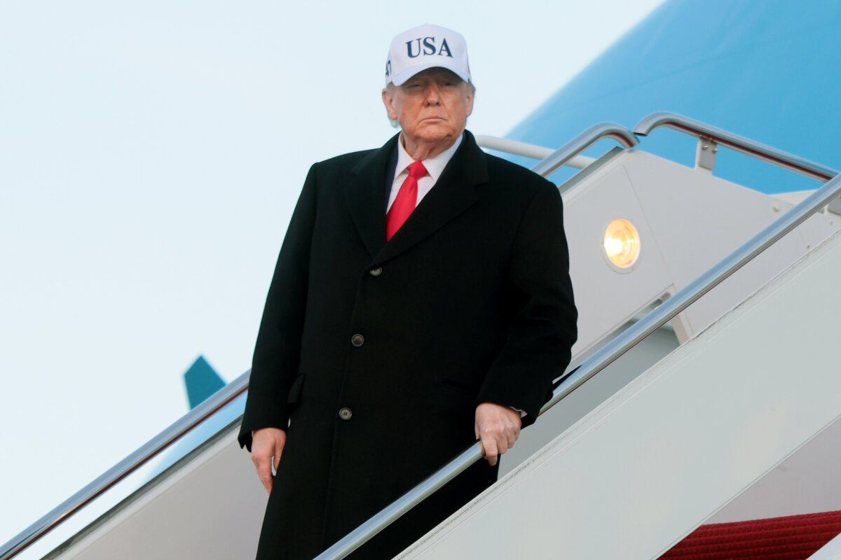 U.S. President Donald Trump walks down the air stairs after landing on Air Force One at Joint Base Andrews, Md., on Jan. 13, 2026. (Anna Moneymaker/Getty Images)