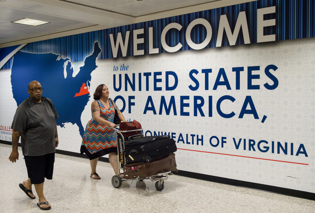 International travelers leave the Customs and Immigration area of Dulles International Airport in Dulles, Va., on June 29, 2017. (Paul J. Richards/AFP/Getty Images)
