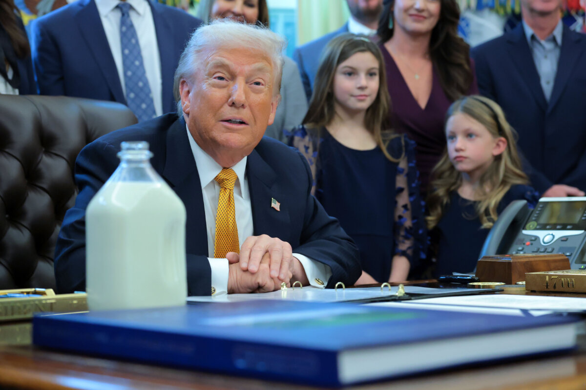 President Donald Trump jokes with attendees before signing bills in the Oval Office of the White House on Jan. 14, 2026. (Brendan Smialowski/AFP via Getty Images)
