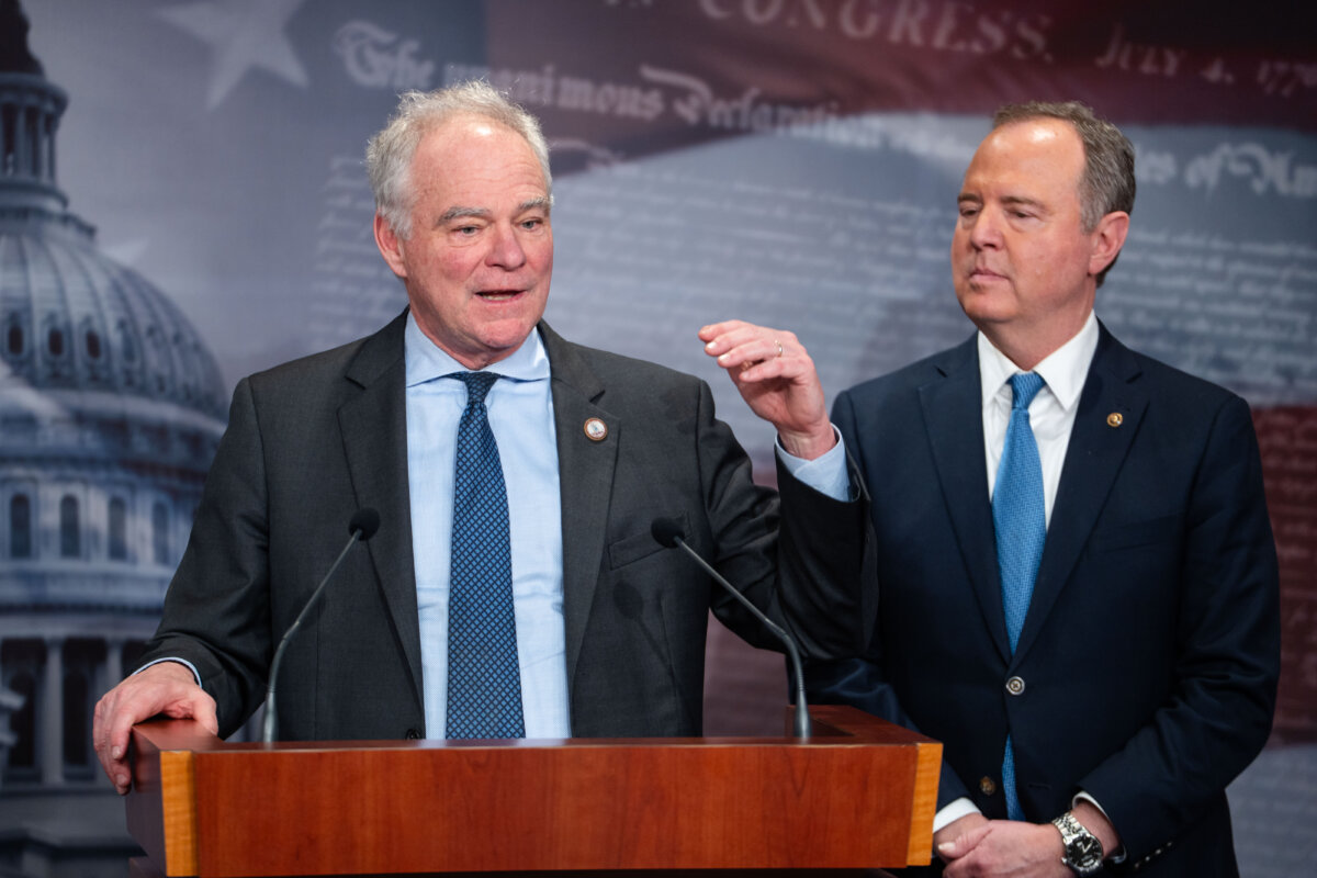 Sen. Tim Kaine (D-Va.) and Sen. Adam Schiff (D-Calif.) speak at a press conference on Capitol Hill in Washington on Jan. 14, 2025. (Madalina Kilroy/The Epoch Times)