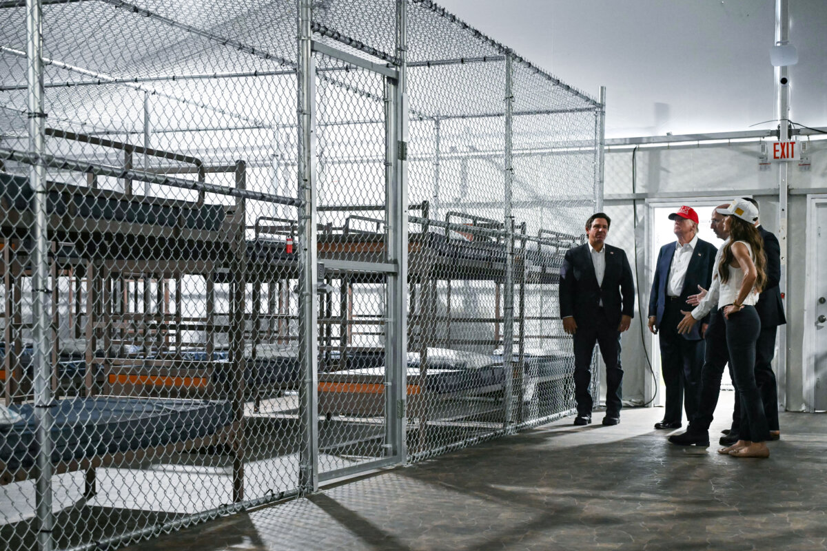 President President Donald Trump (2L), Florida Gov. Ron DeSantis (L), and Secretary of Homeland Security Kristi Noem (R) tour a detention center for illegal immigrants, dubbed Alligator Alcatraz, located at the site of the Dade-Collier Training and Transition Airport in Ochopee, Fla., on July 1, 2025. (Andrew Caballero-Reynolds/AFP via Getty Images)
