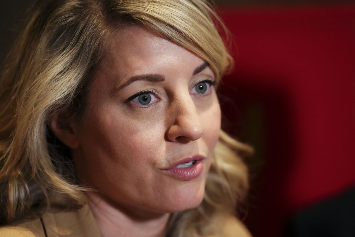Minister of Industry Melanie Joly talks to reporters in Beijing, on Jan. 15, 2026. (Sean Kilpatrick/The Canadian Press)