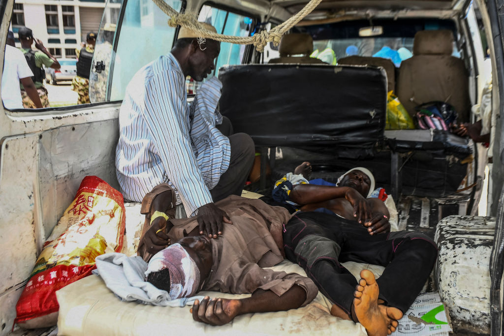 Injured men lie in a van as they arrive for treatment after a wave of suicide attacks in Maiduguri, Nigeria, on June 29, 2024. (Audu Marte/AFP via Getty Images)