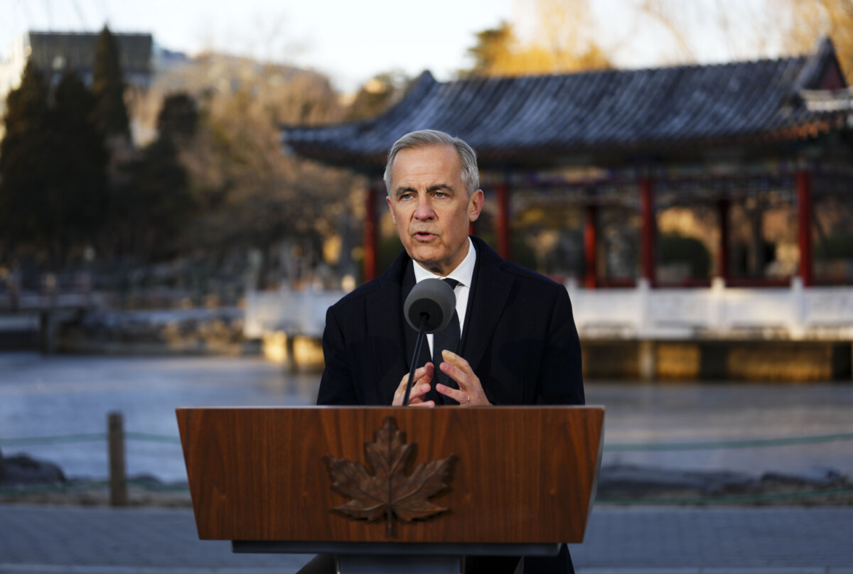 Prime Minister Mark Carney holds a press conference in Ritan Park in Beijing on Jan. 16, 2026. (Sean Kilpatrick/The Canadian Press)