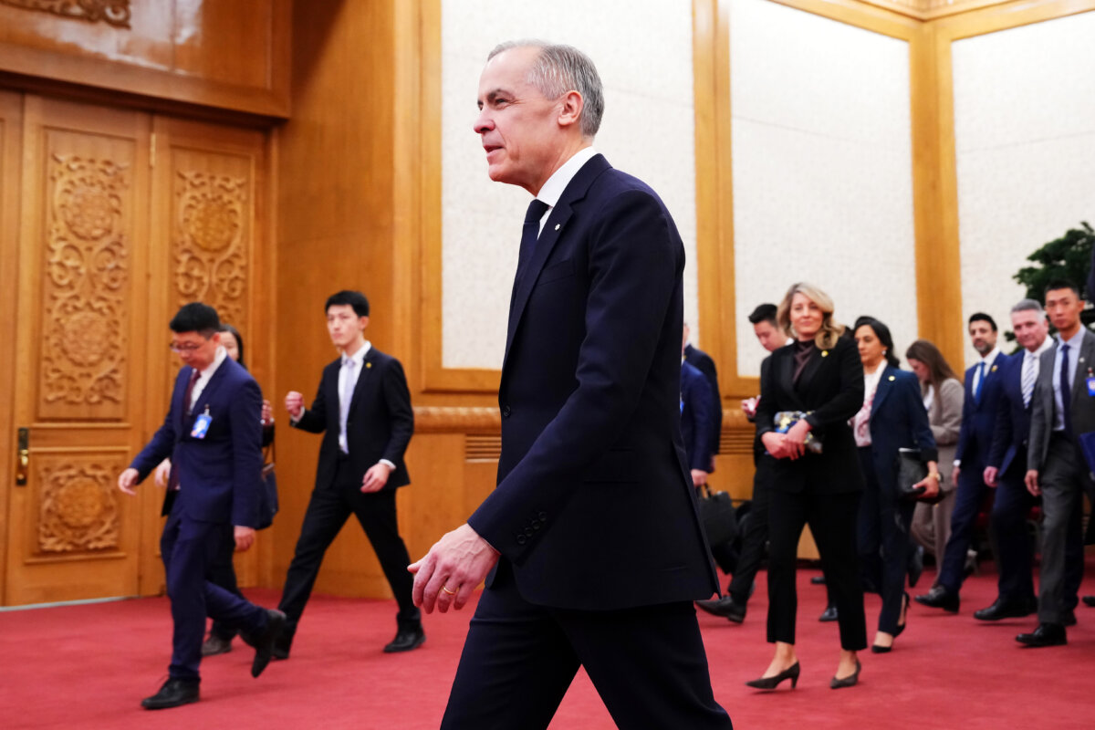 Prime Minister Mark Carney heads for a meeting with Chinese leader Xi Jinping at the Great Hall of the People in Beijing on Jan. 16, 2026. (The Canadian Press/Sean Kilpatrick)