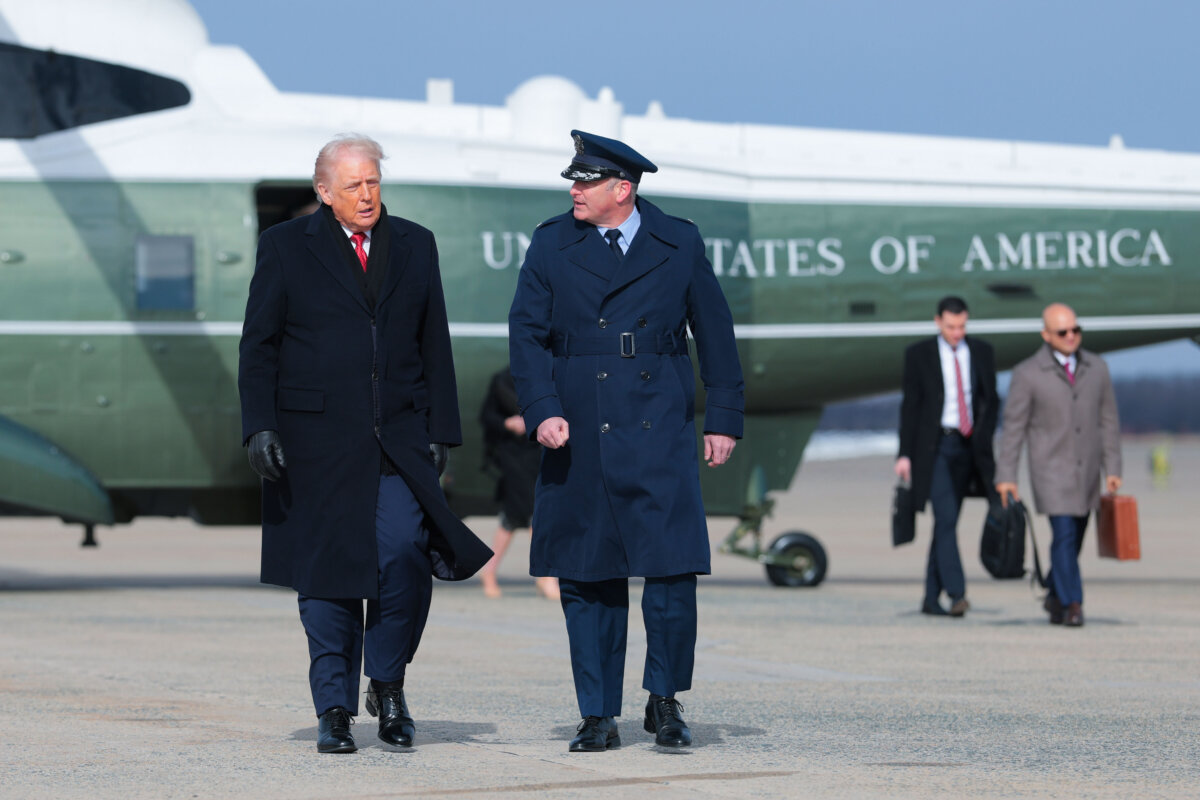 President Donald Trump (L) walks to board Air Force One in Joint Base Andrews, Md., on Jan. 16, 2026. (Anna Moneymaker/Getty Images)