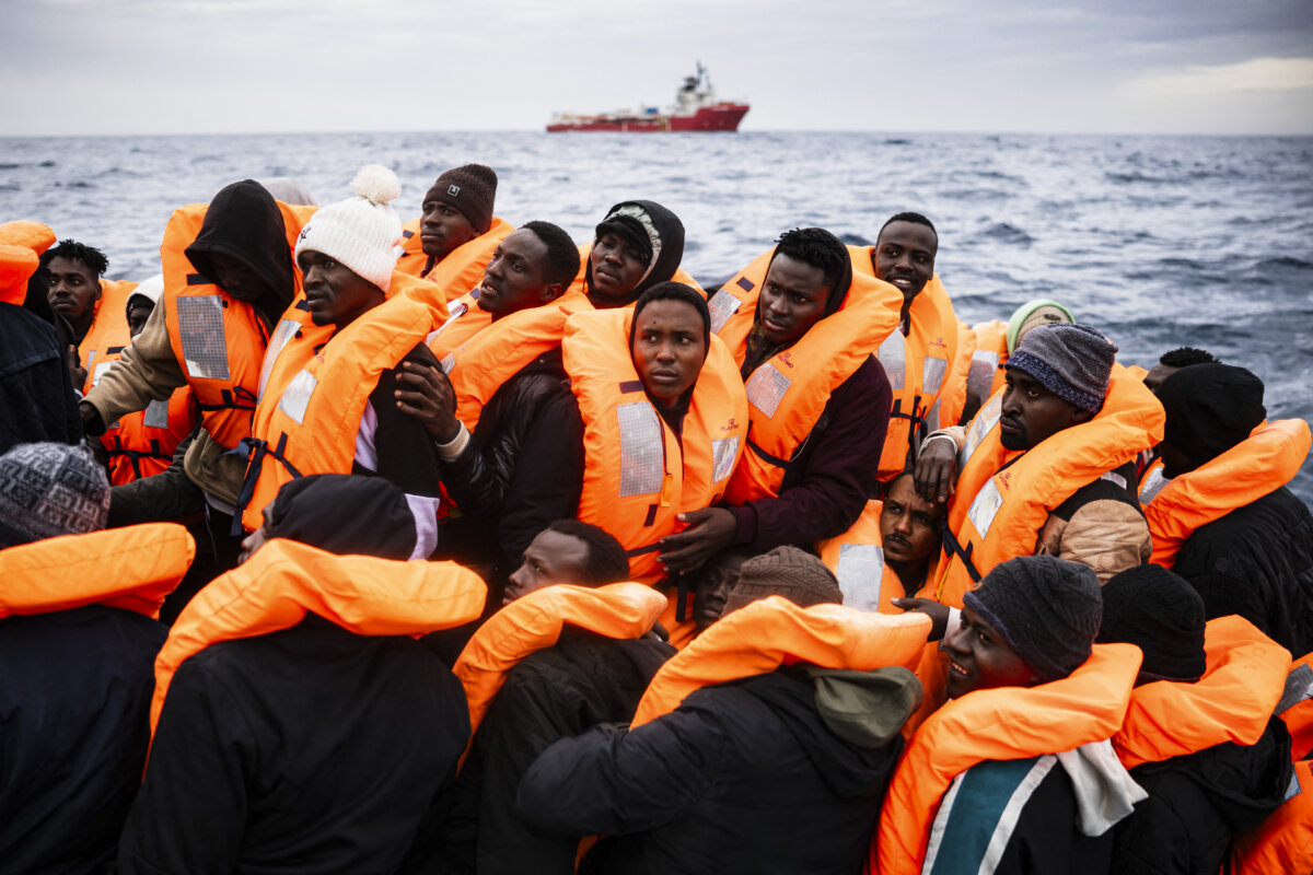 Migrants aboard a rubber boat wait as they are rescued by the Ocean Viking rescue ship off the coast of Libya, on Jan. 16, 2026. (Sameer Al-Doumy/AFP via Getty Images)