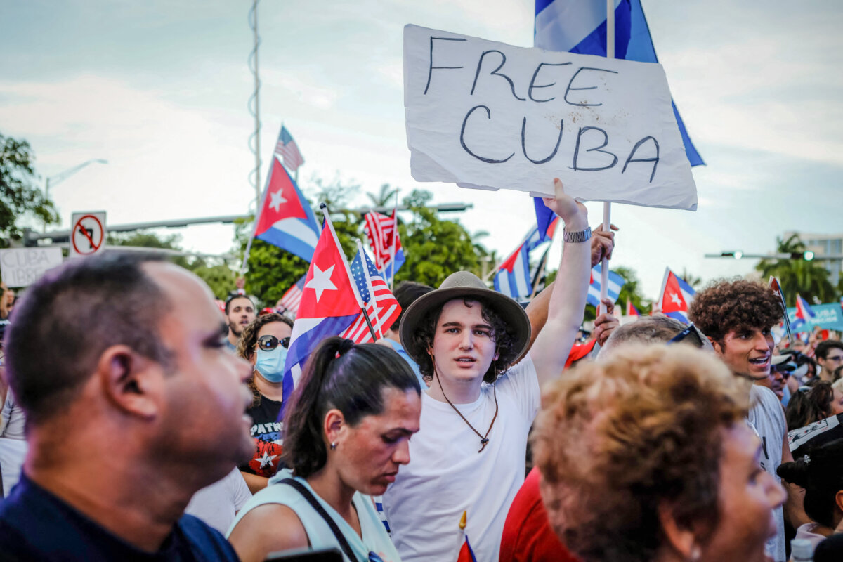 A man holds a “Free Cuba” sign during a rally showing support for Cubans demonstrating against the Cuban communist regime, at Freedom Tower in Miami, on July 17, 2021. (Eva Marie Utzcategui/AFP via Getty Images)