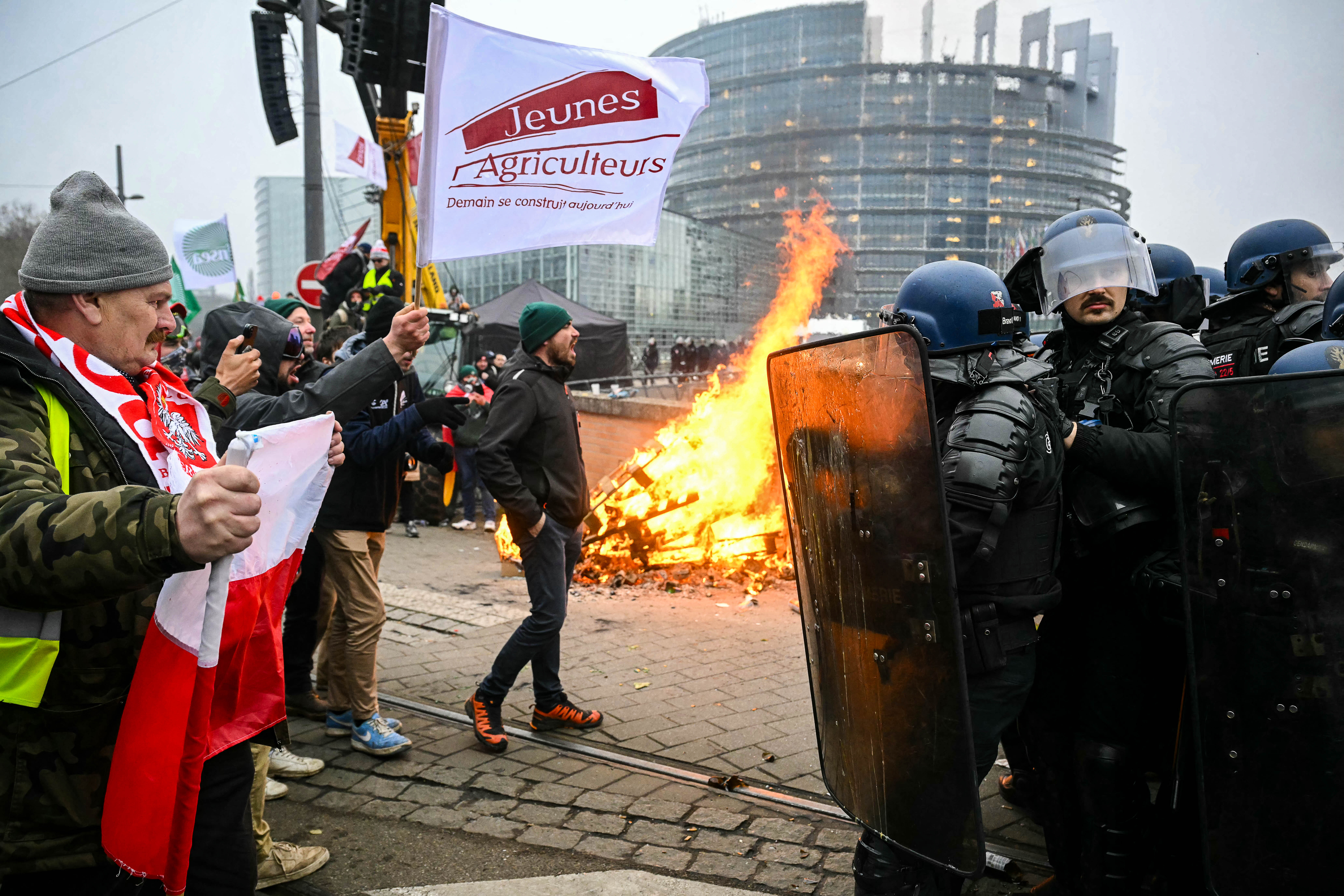 Day in Photos: Protests Near European Parliament, Blackout in Kyiv, and Northern Lights in Germany