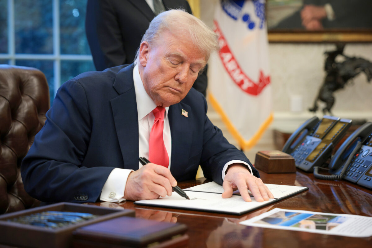 President Donald Trump signs an executive order in the Oval Office on Feb. 25, 2025. (Alex Wong/Getty Images)