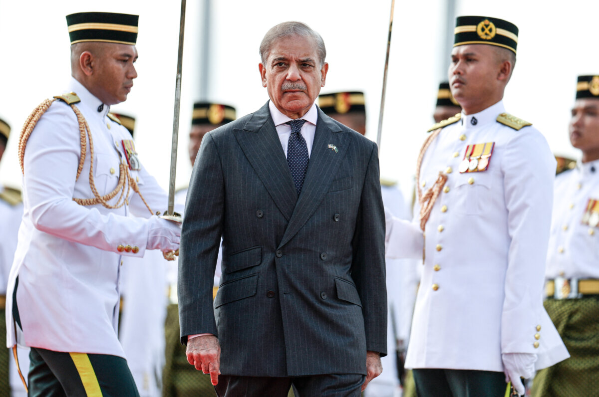 Pakistan's Prime Minister Shehbaz Sharif inspects the honour guard in Putrajaya, Malaysia, on Oct. 6, 2025. (Hasnoor Hussain/POOL/AFP via Getty Images)