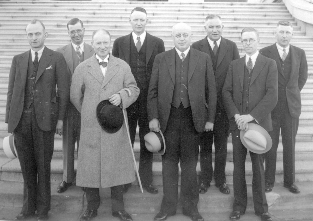 Alberta Premier William Aberhart (C) and his cabinet pose on the steps of the Legislative Building in Edmonton in 1935. Aberhart’s use of radio revolutionized Alberta politics. (Public Domain)