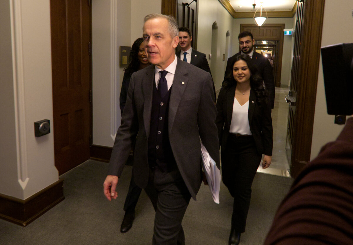 Prime Minister Mark Carney arrives for a caucus meeting on Parliament Hill in Ottawa on Jan. 25, 2026. (The Canadian Press/Patrick Doyle)