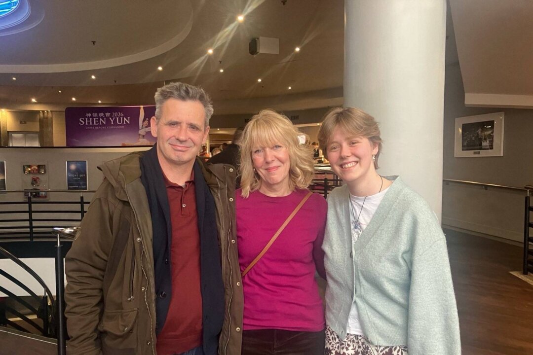 The Dobson family, Andy, Bella, and Lilia, attended Shen Yun Performing Arts at the Victoria Theatre in Woking, England, on Jan. 25, 2026. (Huang Shishun/The Epoch Times)