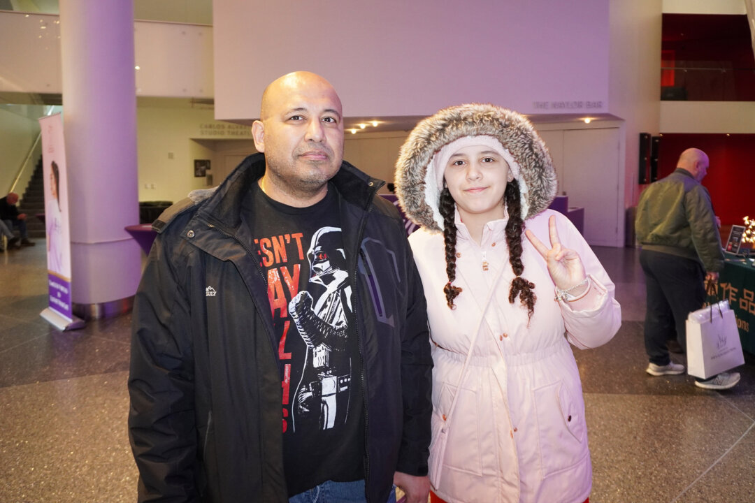 Robert Vazquez Jaramillo and his daughter, Zeneah, watch Shen Yun Performing Arts at the Tobin Center for the Performing Arts in San Antonio on Jan. 25, 2026. (Sonia Wu/The Epoch Times)
