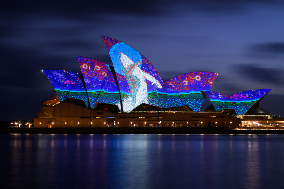 The sails of the Sydney Opera House are illuminated by a projection of artwork ‘Dancing in the Moonlight' by artist Garry Purchase during the Dawn Reflection ceremony in Sydney, Australia, on Jan. 26, 2026. (George Chan/Getty Images)