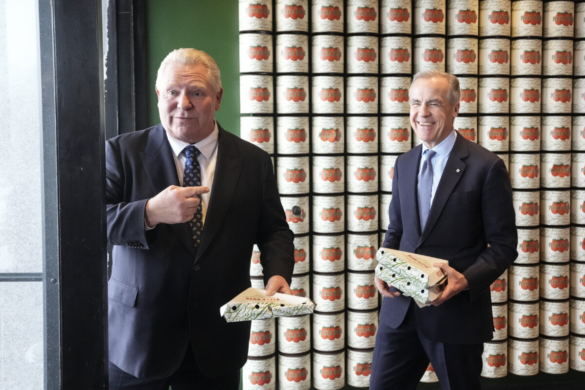 Prime Minister Mark Carney and Ontario Premier Doug Ford order pizza at a local franchise after their meeting on Jan. 26, 2026. (The Canadian Press/Chris Young)
