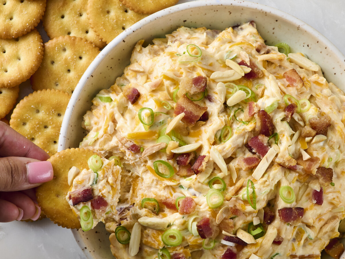 A creamy, cheesy dip loaded with bacon, toasted almonds, and a hint of spice, perfect for parties or snacking. (Alex Lepe /TCA)