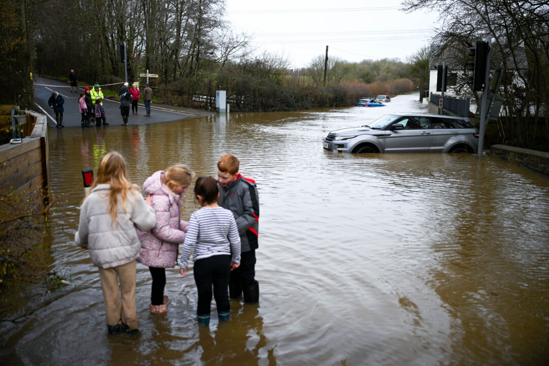 Day in Photos: Flood in England, Tsunami Museum, and Ice in the Hudson River