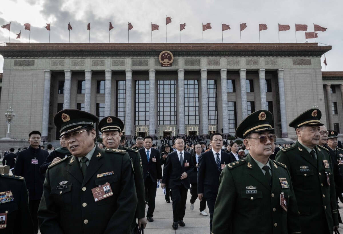 Military officers and other delegates leave the opening session of the Chinese People's Political Consultative Conference at the Great Hall of the People in Beijing on March 4, 2025. (Kevin Frayer/Getty Images)