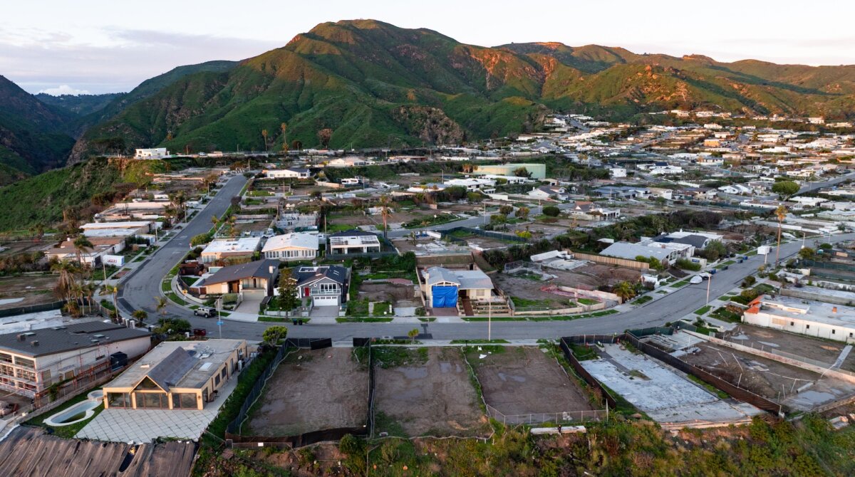 An aerial view shows empty lots and new homes under construction in the Pacific Palisades neighborhood of Los Angeles on Jan. 5, 2026. (Josh Edelson/AFP via Getty Images)
