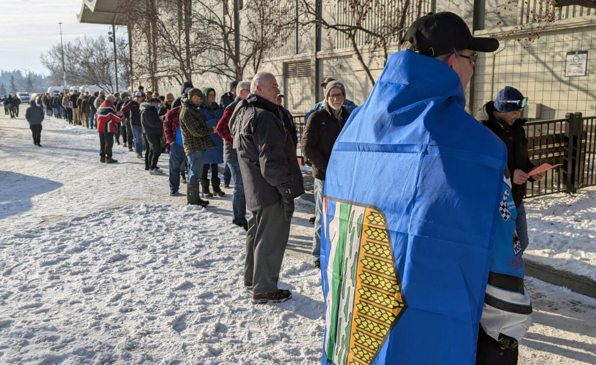 People line up at the Big Four Building to sign a petition triggering a referendum asking if Alberta should secede from Canada, in Calgary on Jan. 26, 2026. (The Canadian Press/Dayne Patterson)