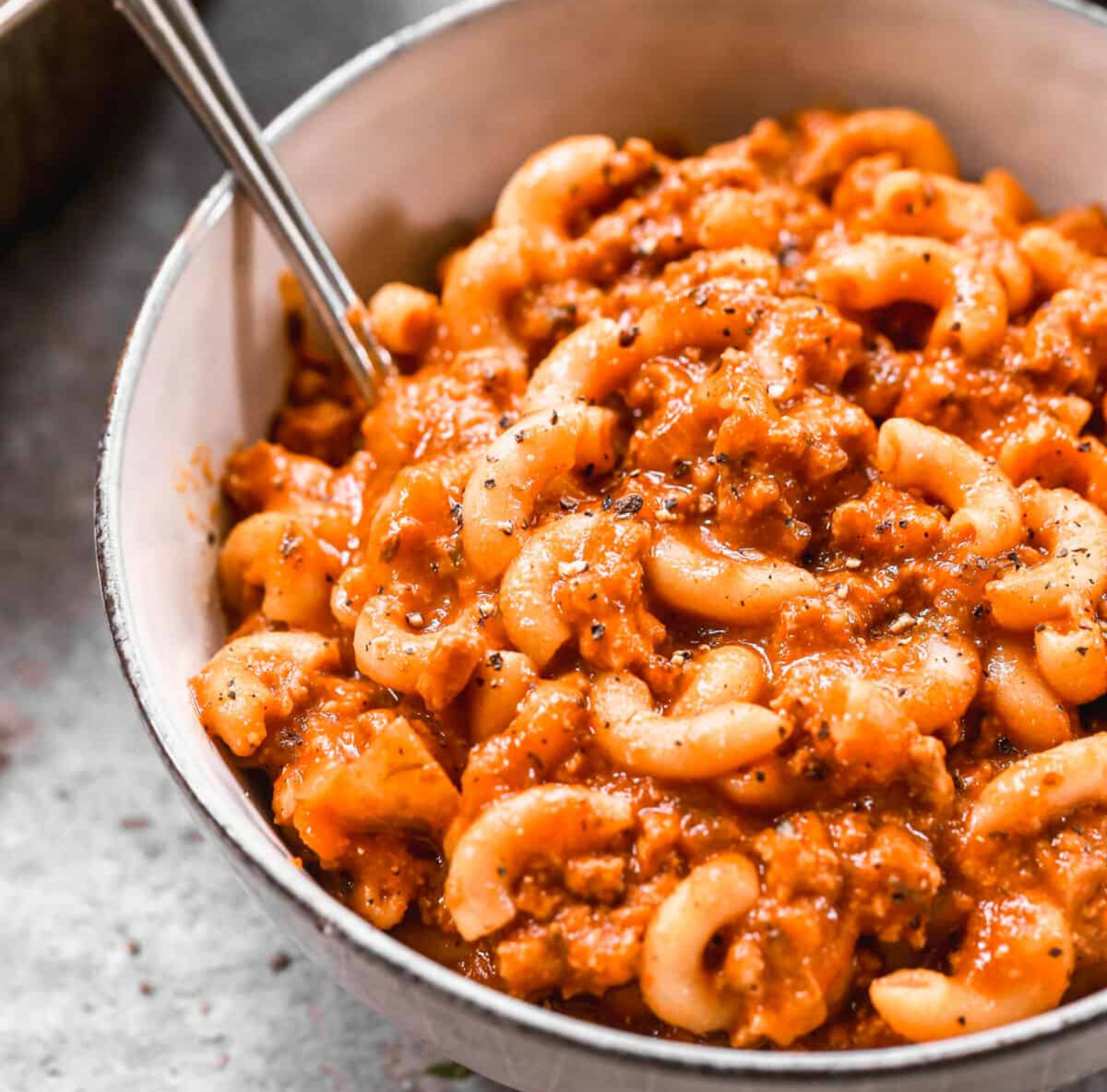 Delicious American Goulash (Beefaroni) made with ground beef and elbow pasta in a flavorful and cheesy red sauce. It's made all in one pan and is picky-eater approved! (Lauren Allen)