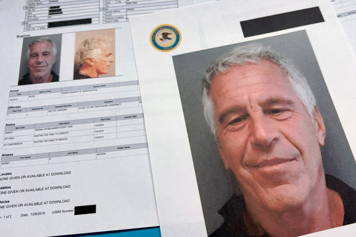 Documents that were included in the U.S. Department of Justice release of the Jeffrey Epstein files are photographed on Jan. 2, 2026. (Jon Elswick/AP Photo)