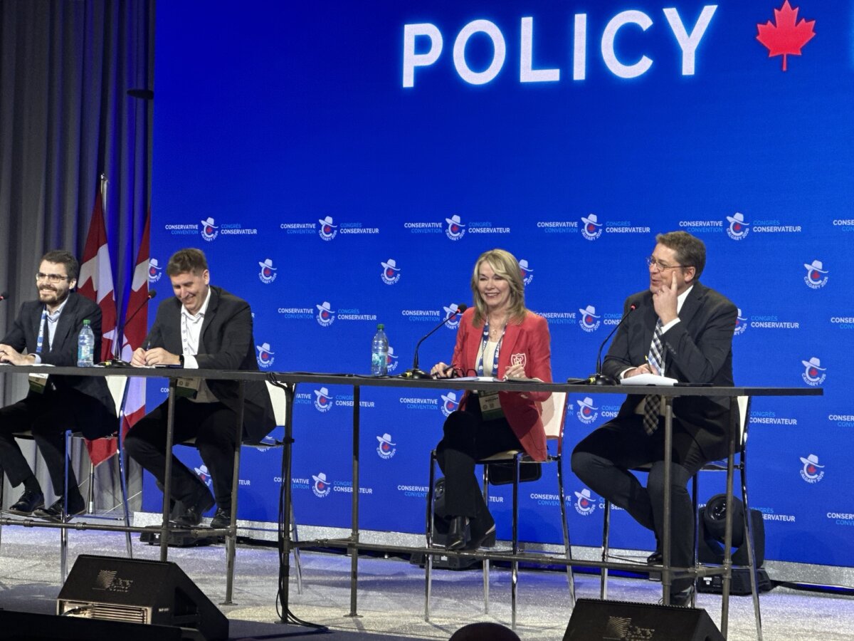 Conservative MP Andrew Scheer (R), seated next to former Conservative Interim Leader and MP Candice Bergen, speaks during a policy debate session the two co-hosted at the Conservative Party convention in Calgary on Jan. 31, 2026. (Omid Ghoreishi/The Epoch Times)