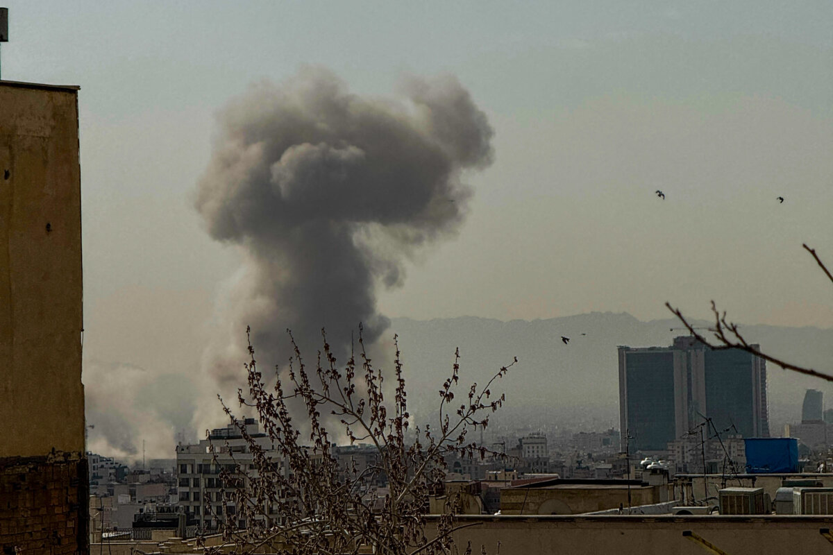 A plume of smoke rises over Tehran after an explosion on Feb. 28, 2026. (Mahsa/Middle East Images/AFP via Getty Images)