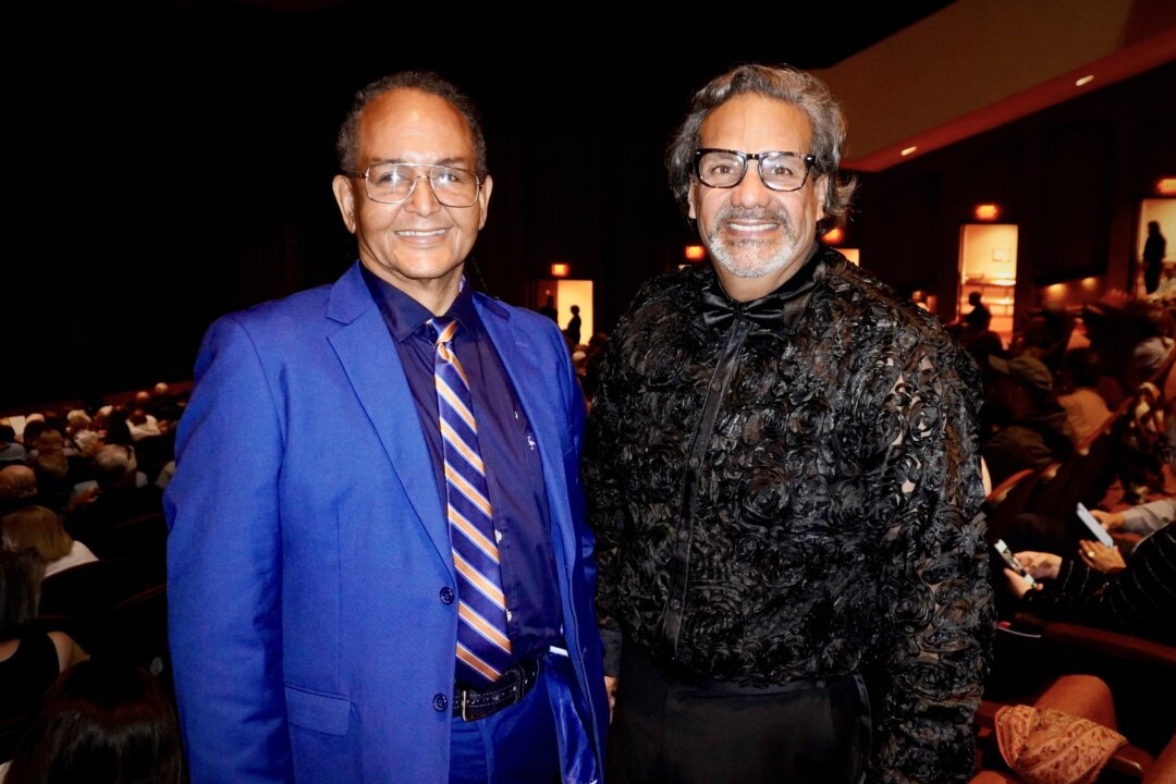 Pastor and retired pharmacist Carlos Diaz (R) and a friend enjoyed the second performance by Shen Yun North America Company at the Centro de Bellas Artes Luis A. Ferré in San Juan, on Feb. 27, 2026. (Huixin Lin/The Epoch Times)