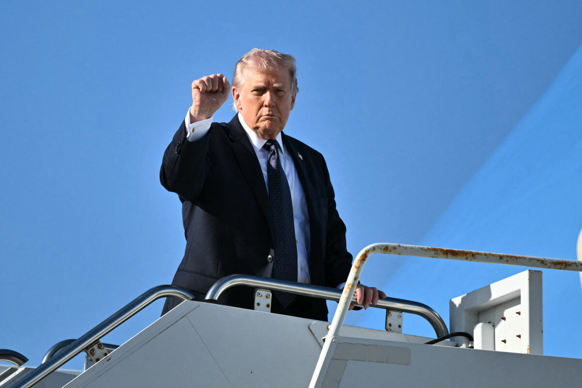 President Donald Trump gestures as he boards Air Force One before departing Palm Beach International Airport in West Palm Beach, Fla., on March 1, 2026, on his way back to Washington. (Mandel Ngan/AFP via Getty Images)
