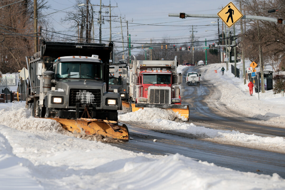 Dump trucks plow snow and ice off of New Hampshire Avenue following a winter storm in Silver Spring, Md., on Jan. 26, 2026. (Chip Somodevilla/Getty Images)