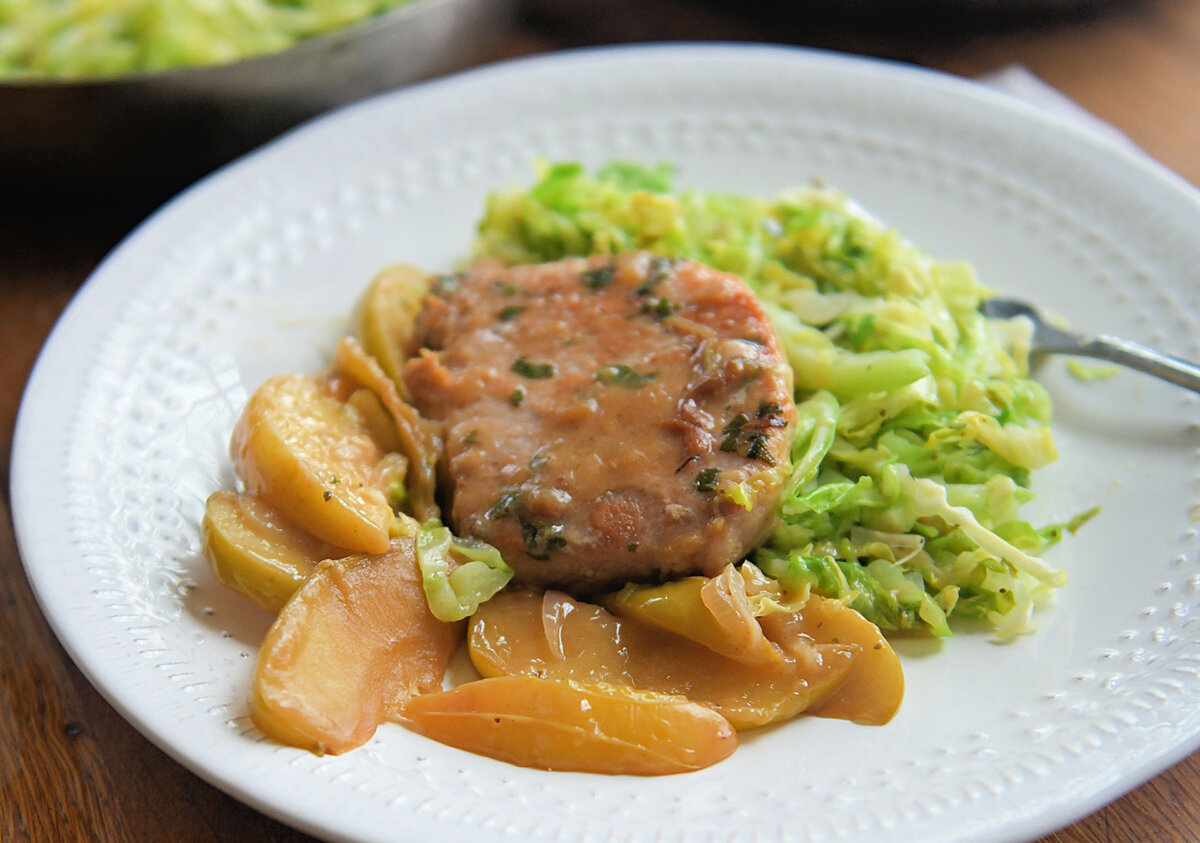Pork chops served with sauteed apples and a warm cabbage slaw. (Gretchen McKay/Pittsburgh Post-Gazette/TNS)