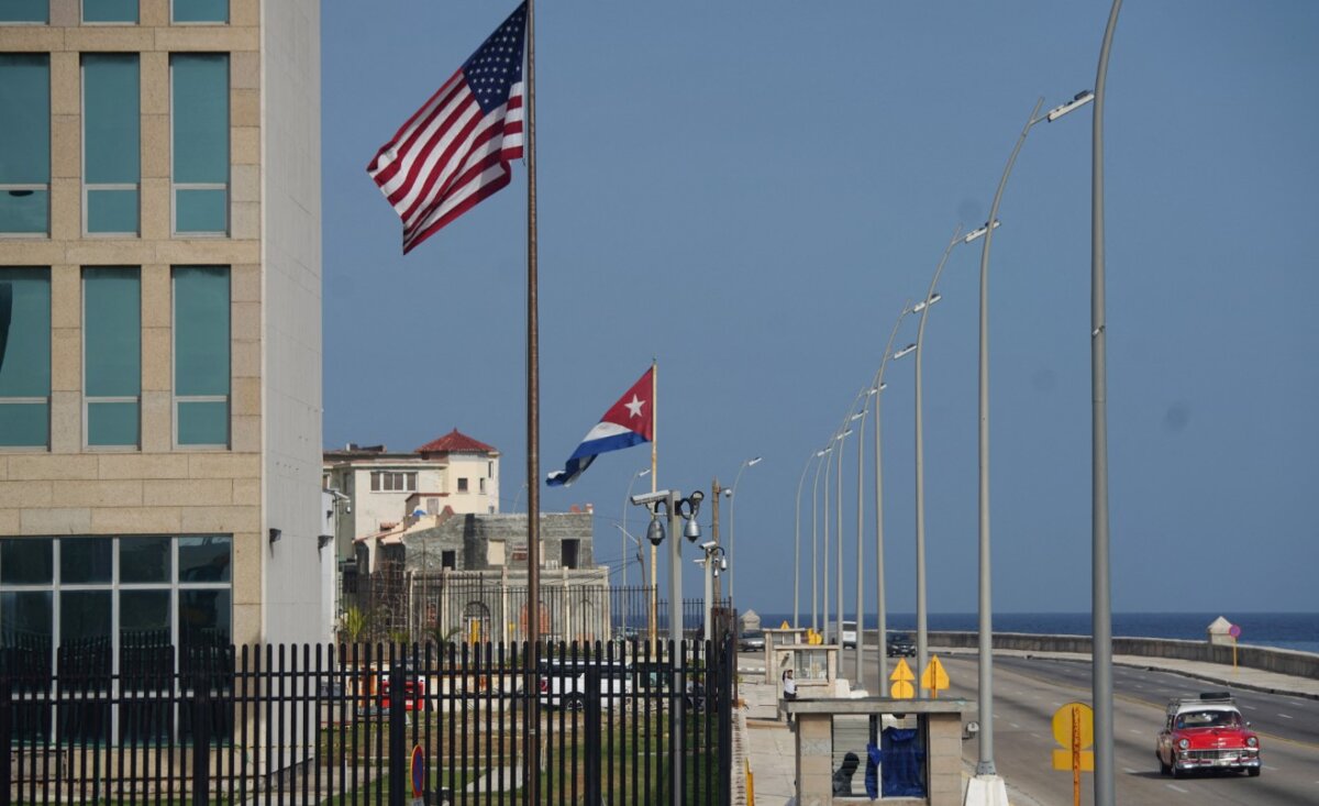 A vintage car passes by the U.S. Embassy in Havana, Cuba, on June 15, 2022. (Alexandre Meneghini/Reuters)