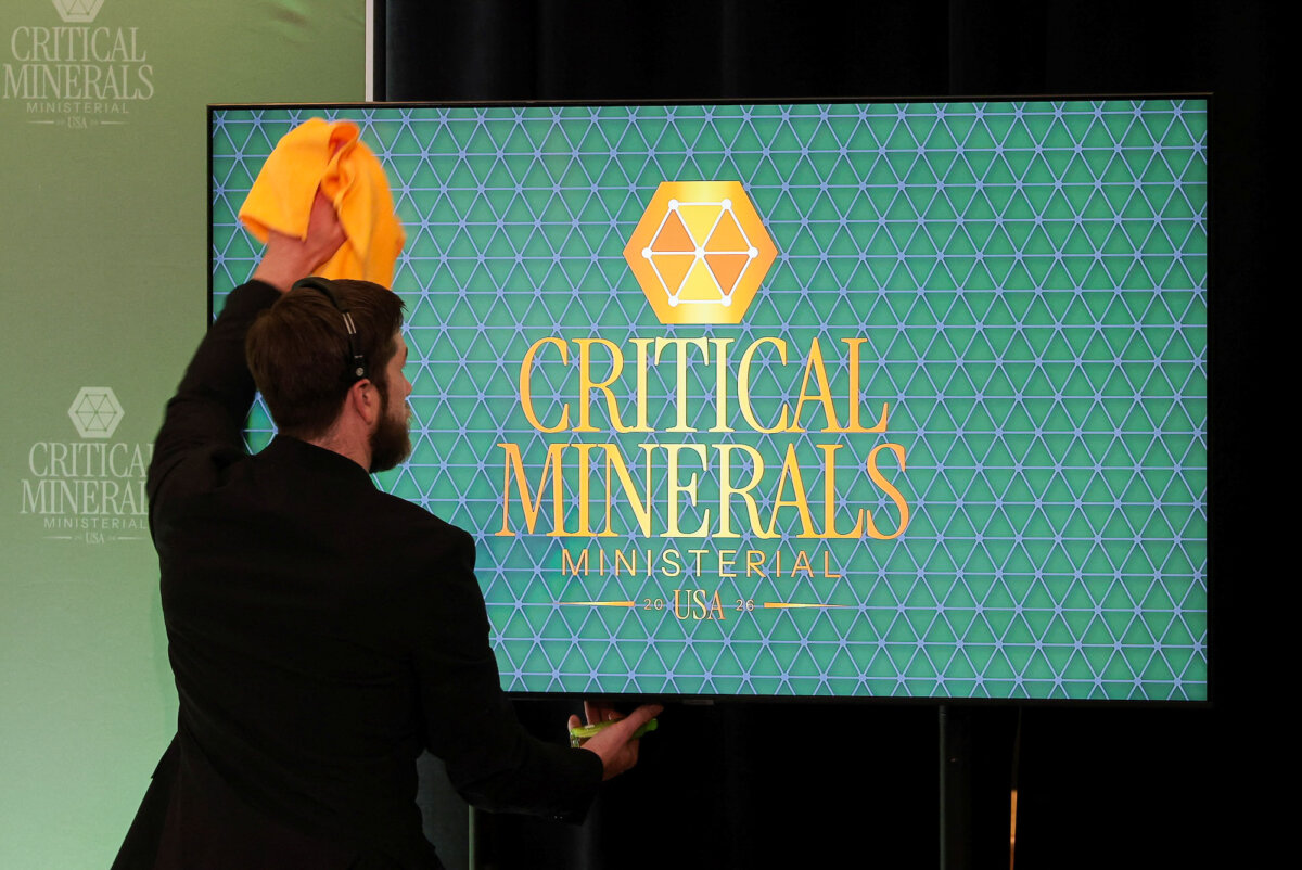 An aide wipes clean a video screen ahead of the Critical Minerals ministerial meeting at the State Department in Washington, on Feb.4, 2026. (Jonathan Ernst/Reuters)