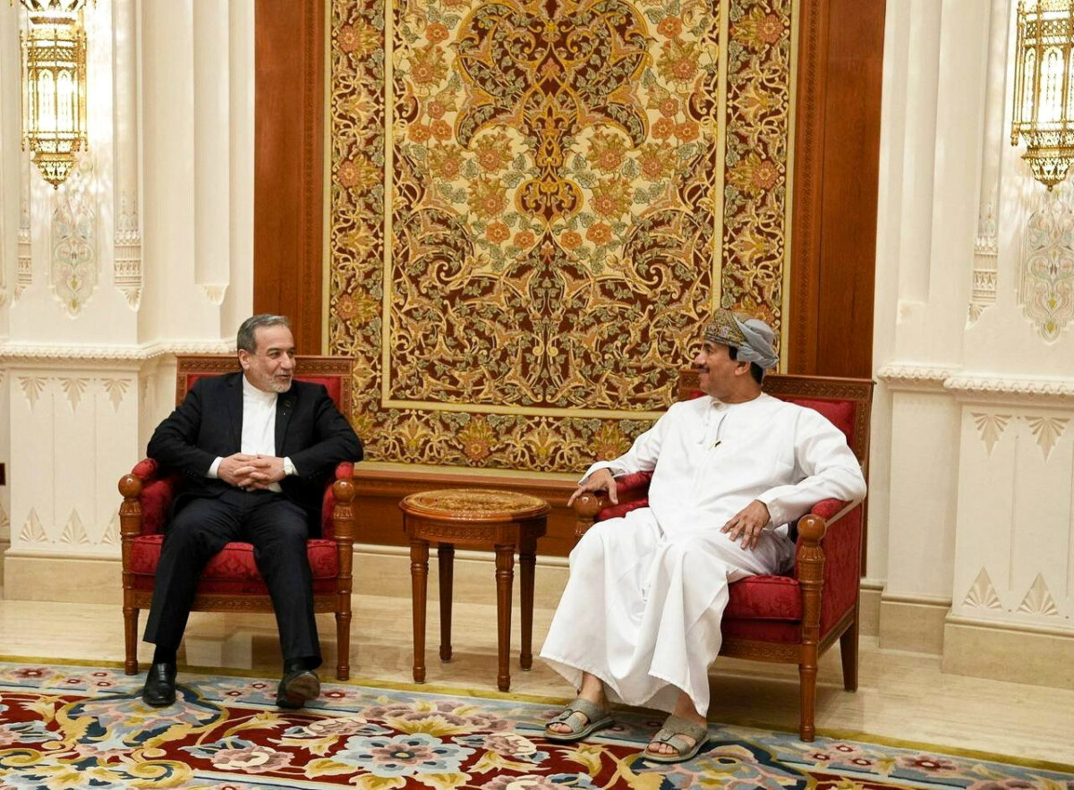 Iran's Foreign Minister Abbas Araghchi is welcomed by an Omani official upon his arrival in Muscat, Oman, on Feb. 6, 2026. (Iranian Foreign Ministry/WANA (West Asia News Agency)/Handout via Reuters)