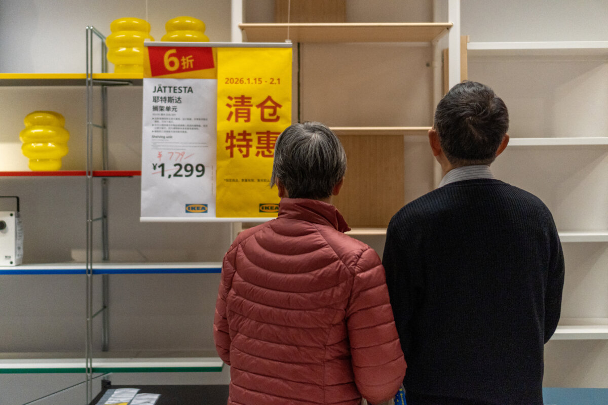 Couple inspects empty shelves as IKEA prepares to close, in Shanghai, China, on Jan. 15th, 2026. (Andrea Aimar/Hans Lucas/AFP via Getty Images)