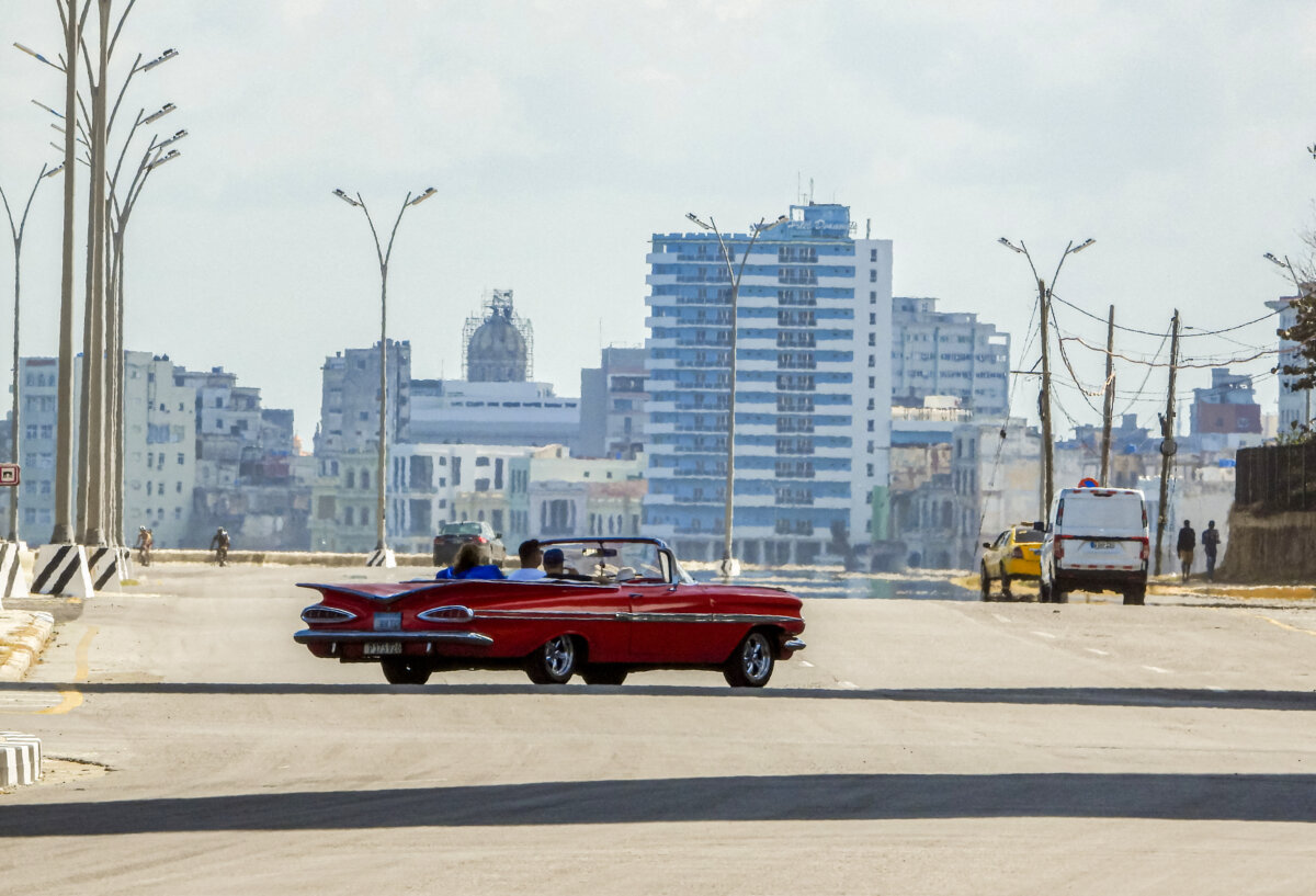 Tourists ride in an old American car used as a taxi along a quiet avenue in Havana on Feb. 8, 2026.(Adalberto Roque/AFP via Getty Images)