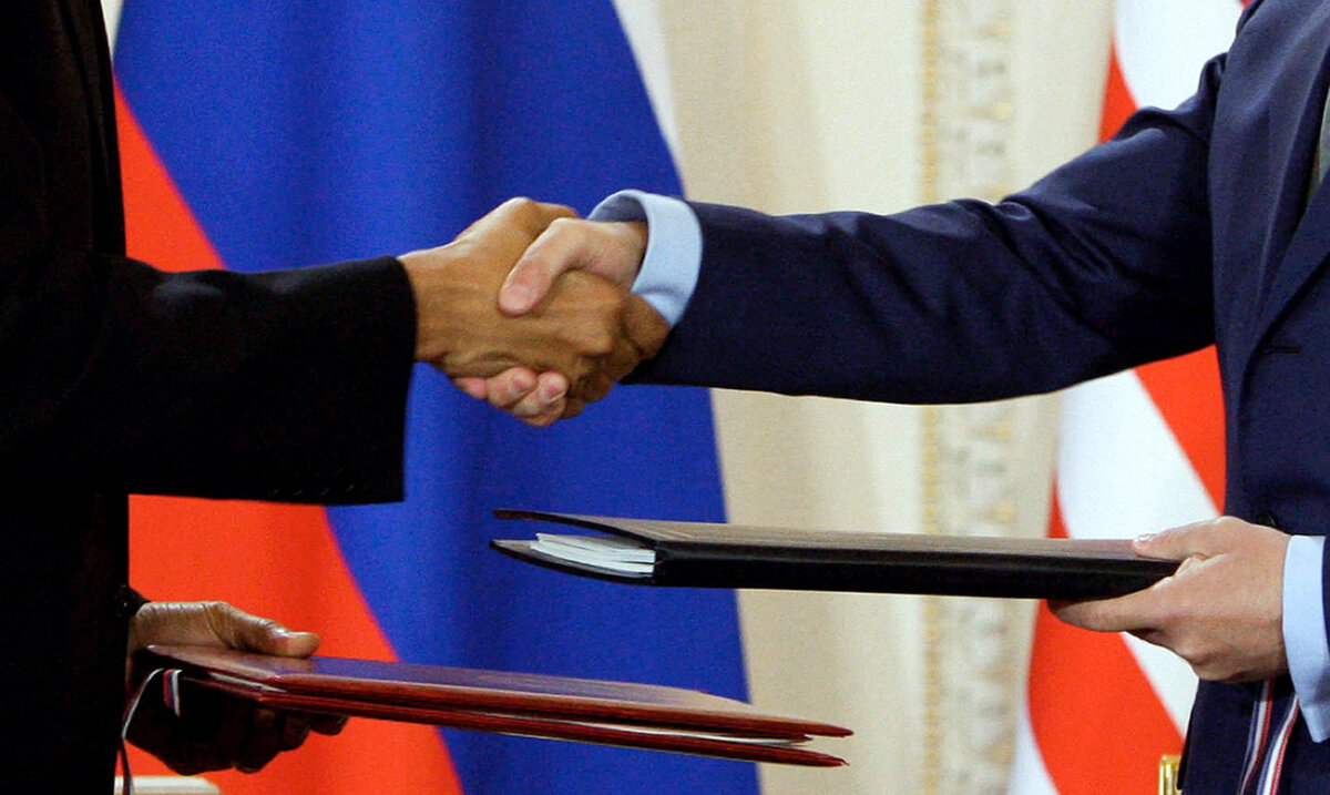 U.S. President Barack Obama (L) and his Russian counterpart Dmitry Medvedev shake hands after signing the new Strategic Arms Reduction Treaty in Prague on April 8, 2010. (Dmitry Astakhov/Ria Novosti/AFP via Getty Images)
