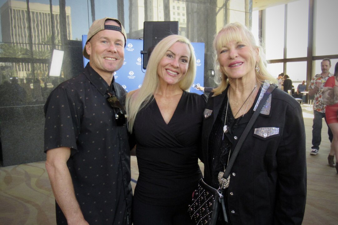 Monique Sharp and her husband with Robyn Sharp (R) at the Shen Yun Performing Arts performance at Terrace Theater on Feb. 8, 2026. (Linda Jiang/The Epoch Times)