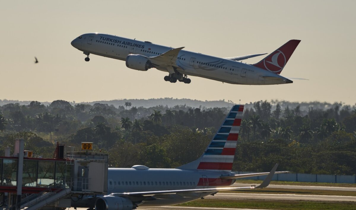 A Turkish Airlines plane passes an American Airlines jet and takes off at José Martí International Airport in Havana on Feb. 9, 2026. (Ramon Espinosa/AP)