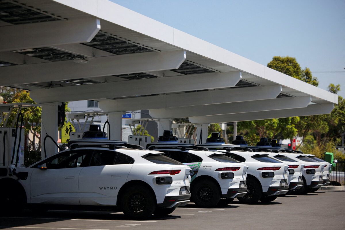 Waymo driverless vehicles charge at a Waymo charging station in Santa Monica, Calif., on May 30, 2025. (Daniel Cole/Reuters)