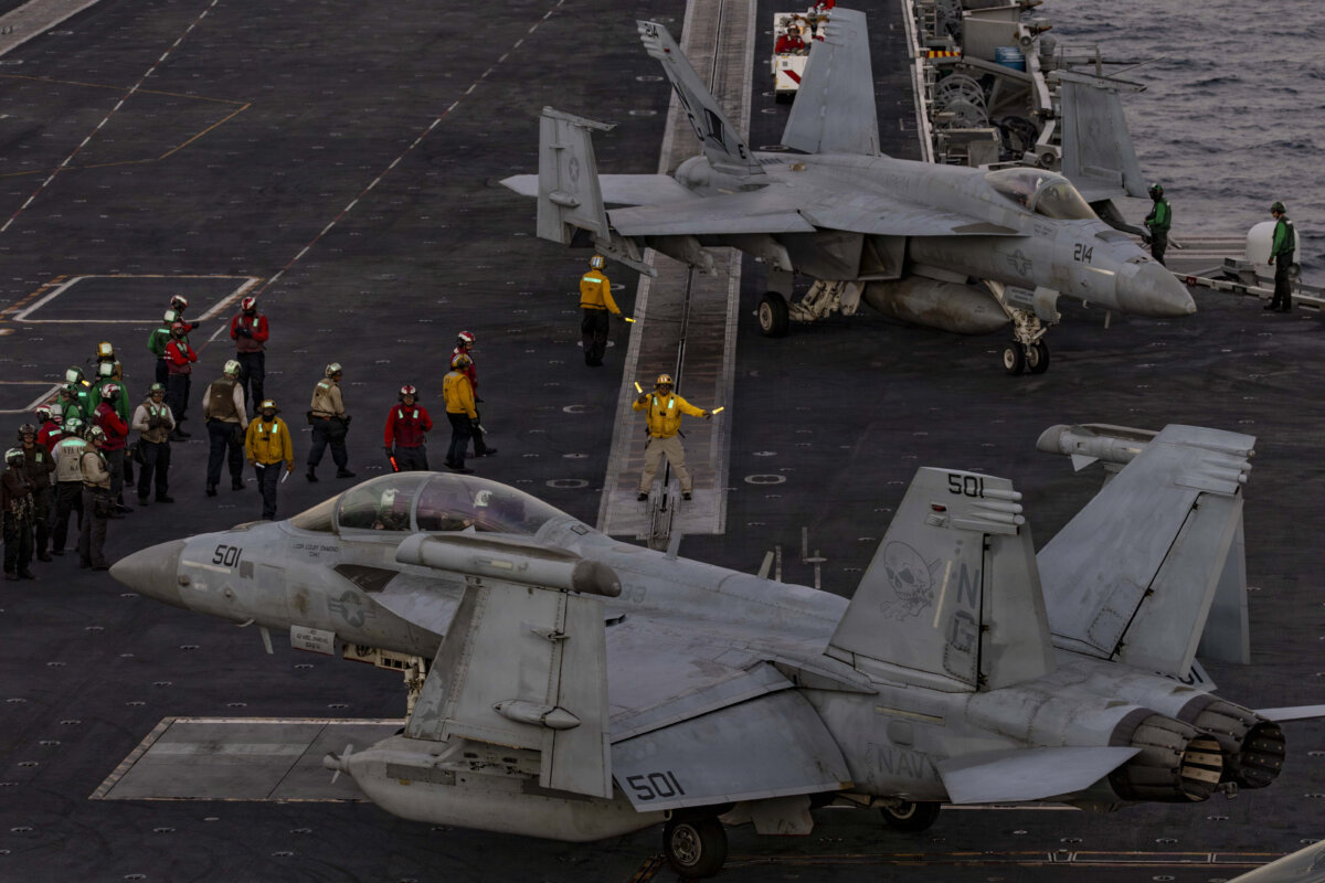 U.S. Sailors direct an EA-18G Growler on the flight deck of the aircraft carrier USS Abraham Lincoln (CVN 72) in the Arabian Sea on Feb. 3, 2026. (Mass Communication Specialist Seaman Zoe Simpson/U.S. Navy via DVIDS)
